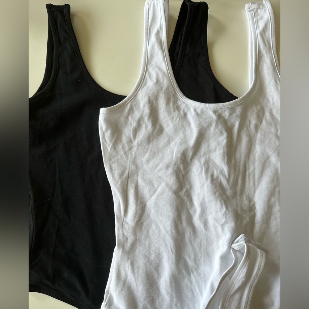 TWO new bodysuits white / black size Medium